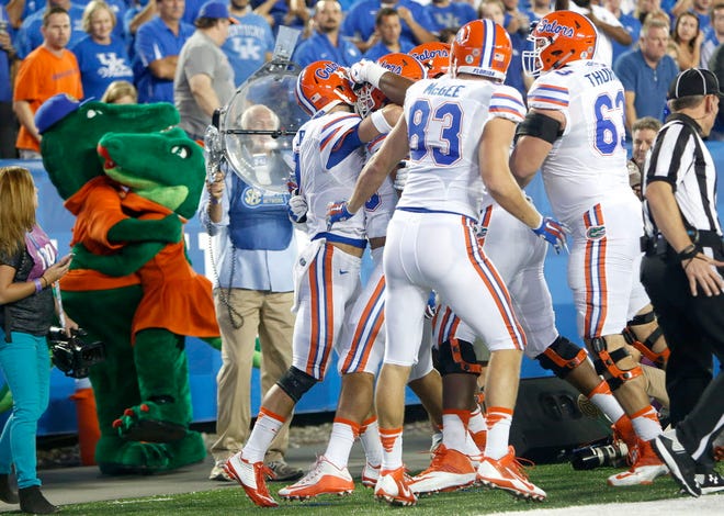 The Florida Gators celebrate after quarterback Will Grier scored a touchdown against the Kentucky Wildcats during the first half at Commonwealth Stadium on Saturday, Sept. 19, 2015 in Lexington, Ky. Matt Stamey/Staff photographer
