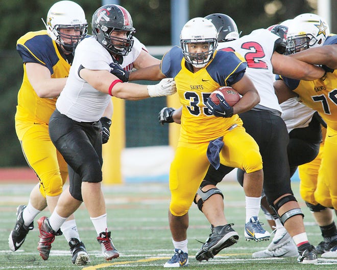 Siena Heights running back D'aries Davis gains yards during Saturday's Mid-States Football Association Mideast League game against Concordia.