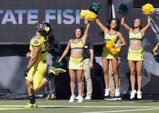 Oregon's Joe Walker exhales as he crosses the goal line after he recovered a Georgia State fumble in the fourth quarter at Autzen Stadium on Saturday, September 19, 2015. (Andy Nelson/The Register-Guard)