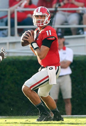Georgia quarterback Greyson Lambert drops back to pass during the first half against South Carolina on Saturday in Athens, Ga. Georgia won 52-20. (AP Photo/John Bazemore)