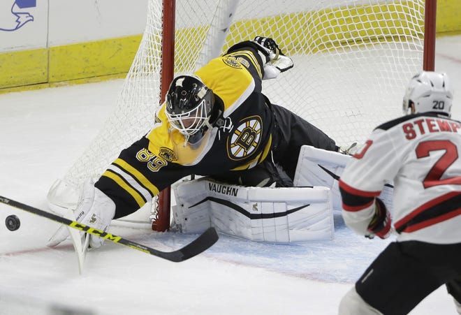 Bruins goalie Jonas Gustavsson deflects the puck during the first period of Sunday's preseason game, in Providence, R.I. The Associated Press