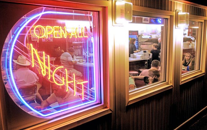 Night owls fill the booths at the Kenmore Diner, feasting on comfort foods such as bacon, eggs, sausage and home fries in the early morning hours of Sept. 13. T&G STAFF/STEVE LANAVA