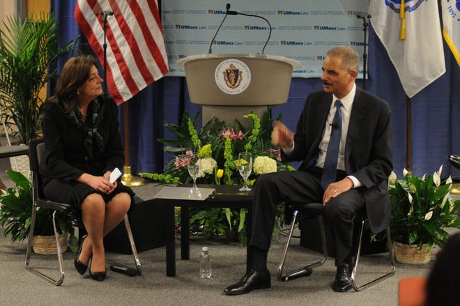 United States Attorney General Eric Holder talks about his views on gun control and serving the public interest with Mary Lu Bilek at the University of Massachusetts School of Law in 2013 in Dartmouth. Bilek, the dean of the school, said Holder is the ideal role model for UMass law students.