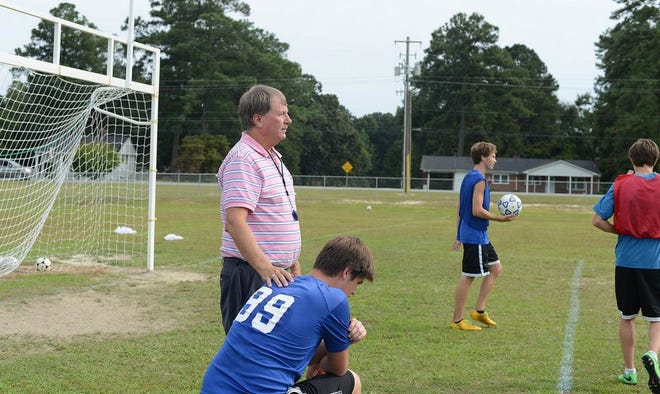 Bethel Christian coach Gary O’Neal shares a brief word with goalkeeper Cole Williams while watching his team’s practice on Thursday
