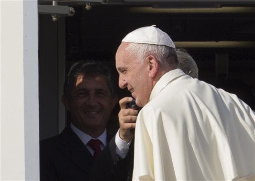 In this Saturday, Sept. 19, 2015 photo, Pope Francis boards his flight to La Habana, Cuba, where he will start a 10-day trip including the United States, at Rome's Fiumicino international airport. No handshakes, selfies or fist bumps when Pope Francis enters the House chamber for his historic speech to Congress on Thursday. That’s the message from House and Senate leaders. (AP Photo/Riccardo De Luca)
