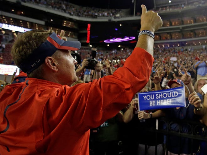 Mississippi head coach Hugh Freeze celebrates with fans after they defeated Alabama 43-37 after an NCAA college football game, Sunday, Sept. 20, 2015, in Tuscaloosa, Ala.