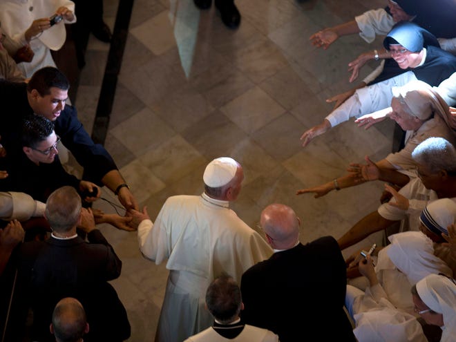 Pope Francis arrives for a vespers service in the San Cristobal cathedral, Havana, Cuba, Sunday.