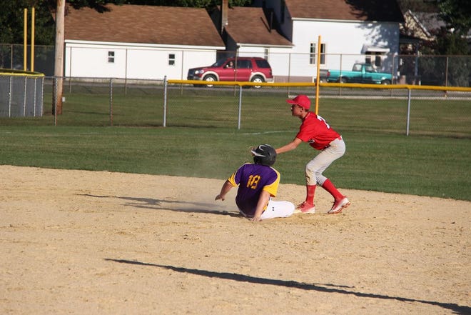 Canton’s Randel Petty slides in safely with a double in the Little Giants’ regional game against Pekin Edison on Monday. Petty’s hit accounted for his team’s only run as the Panthers won 11-1.