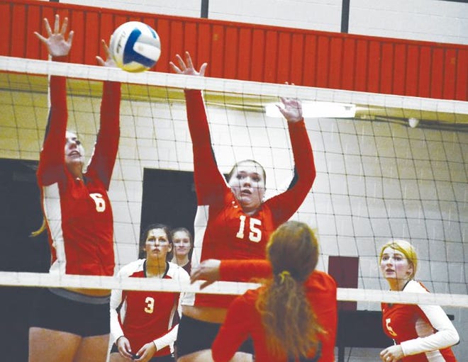 Cheboygan senior Allie Porteous (6) and sophomore Leah Charboneau (15) go up for a block against Rudyard's Jordy Trotter (16) during the first set of a Straits Area Conference match in Cheboygan on Tuesday. Cheboygan teammates Brooke Beaubien (3) and Taryn Jewell (far right) both look on.