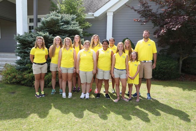 The Madison High School girls golf team, pictured here, has registered a dominating season so far in its first year as a varsity sport. Led by head coach Erik Thompson (right, back row), the Trojans have won all five 
Independent Golf League jamborees this season by an average of 38 strokes. Telegram File Photo by Mike Dickie