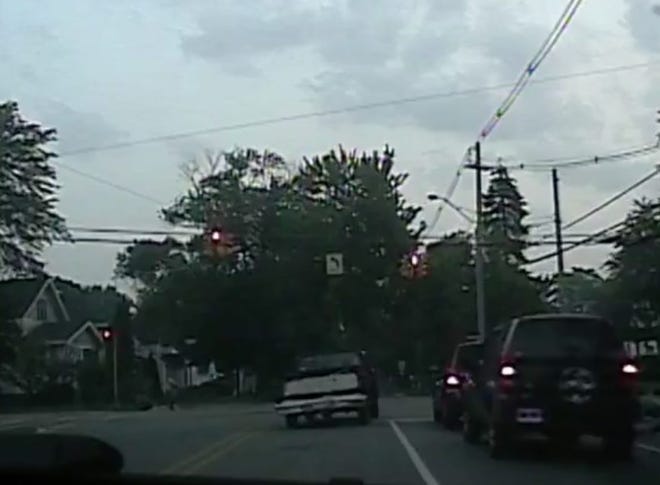 A screen shot from a police dashboard camera shows the suspect in a Sept. 1, 2015, police chase running a red light at 16th Street and Lincoln Avenue. SCREEN SHOT