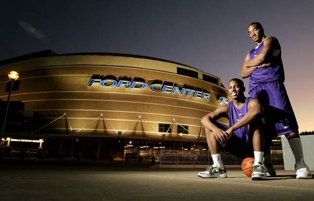 Chris Paul (left) and J.R. Smith pose in front of the Ford Center before the Hornets' inaugural season. (Photo by Bryan Terry)