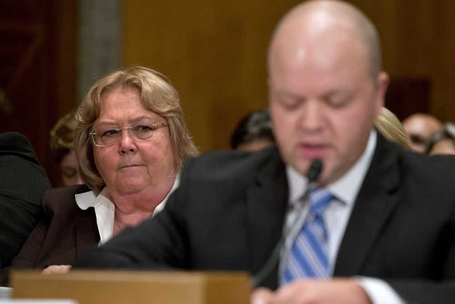 Veterans Affairs Deputy Inspector General Linda Halliday, listens at left, listens as Sean Kirkpatrick of Chicago, testifies on Capitol Hill in Washington, Tuesday, Sept. 22, 2015, before the Senate Homeland Security and Governmental Affairs hearing: "Improving VA Accountability: Examining First-Hand Accounts of Department of Veterans Affairs Whistleblowers." (AP Photo/Jacquelyn Martin)