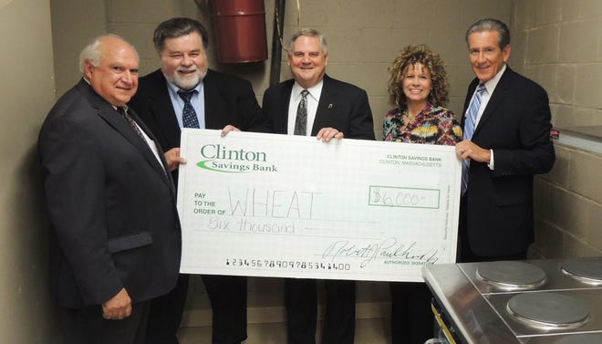 Presenting the check for WHEAT are (from left): Michael Tenaglia, senior vice president and chief information officer at Clinton Savings Bank and a past chairman of the board of the United Way of Tri-County; Paul Mina, Ppresident and chief executive officer of the United Way of Tri County; John Strickland, director of corporate operations, Bose Corporation and chairman of the board of the United Way of Tri-County; Jodi Breidel, north county regional director at United Way of Tri County; and Robert Paulhus Jr., president and CEO of Clinton Savings Bank.