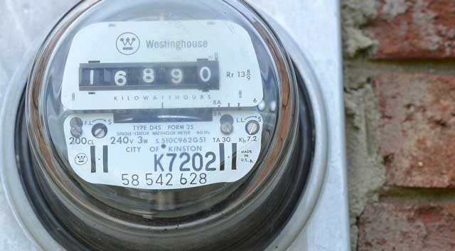 A City of Kinston utility meter runs Tuesday as residents await a decrease in their bill and charge per kilowatt hour.