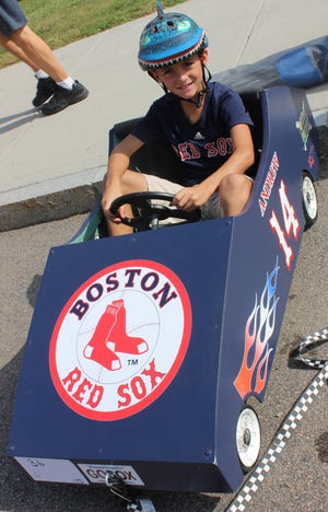 GEORGE AUSTIN/THE SPECTATOR/SCMG

Andrew Heroux, 8, is seen in his car designed with the logo of the Boston Red Sox baseball team.