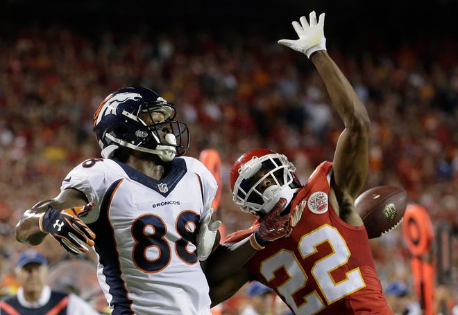 Kansas City Chiefs defensive back Marcus Peters (22) breaks up a pass intended for Denver Broncos wide receiver Demaryius Thomas (88) during the first half of an NFL football game in Kansas City, Mo., Thursday, Sept. 17, 2015. (AP Photo/Charlie Riedel)