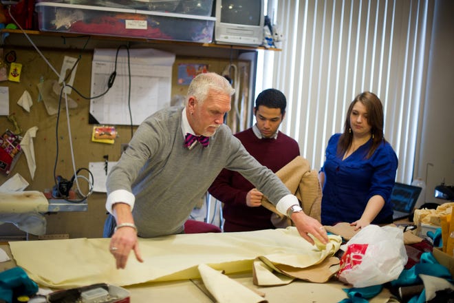 Jeff Hendry (left), professor of performing arts at Rockford University, works with theater students on costume design. PHOTO PROVIDED
