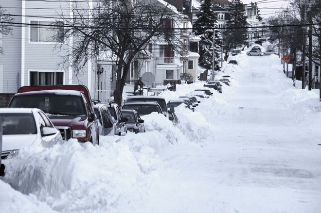 The pain that last winter's record snowfall brought (as seen in this file photo from January of Palmer Street in Fall River) will be felt again this fall when home insurance rate increases kick in.