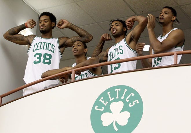 From left, Perry Jones III, Malcolm Miller, James Young and Jordan Mickey of the Celtics mug for the cameras.