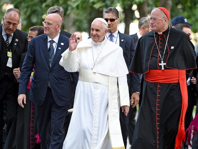 Pope Francis, center, and Cardinal Timothy Dolan, right, arrive for a multi-religious service at the site of the 9/11 memorial and Museum in New York, September 25, 2015. Pope Francis is on a five-day trip to the United States. (Thomas A. Ferrara/Newsday via AP, Pool)