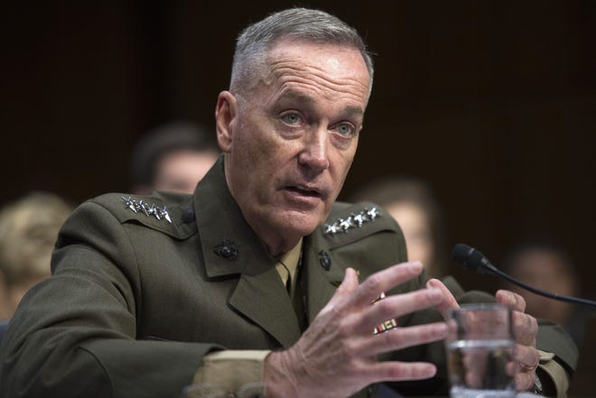 FILE - In this July 9, 2015, file photo, then-Marine Corps Commandant Gen. Joseph Dunford, Jr., testifies during his Senate Armed Services Committee confirmation hearing to become the Chairman of the Joint Chiefs of Staff, on Capitol Hill in Washington. The Marine Corps is expected to ask that women not be allowed to compete for several front-line combat jobs, inflaming tensions between Navy and Marine leaders, U.S. officials say. The tentative decision has ignited a debate over whether Navy Secretary Ray Mabus can veto any Marine Corps proposal to prohibit women from serving in certain infantry and reconnaissance positions. And it puts Dunford, the Marine Corps commandant who takes over soon as chairman of the Joint Chiefs of Staff, at odds with the other three military services, who are expected to open all of their combat jobs to women. (AP Photo/Cliff Owen, File)