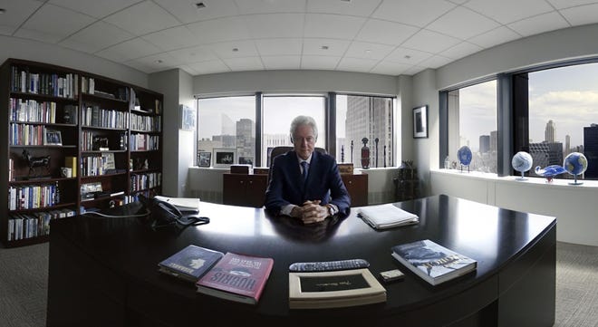 Former U.S. President Bill Clinton sits at his desk in New York in part of a seven-minute movie made with virtual reality techniques.The Associated Press