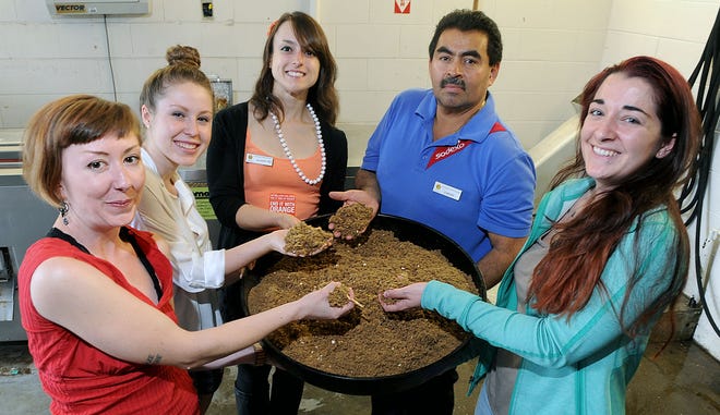 Some of the 3,500 daily meal food scraps from Framingham State University dining halls are pulverized and dehydrated into compost. From left: Food Recovery Network executive board members Jorma McSwiggan of Lawrence, Leah Forristall of Hanover, FSU Dining Services Food Waste Reduction Coordinator Julianna Coughlin; Dining Facilities Manager Carlos Cubias; and board member Meghan Skeehan, from New Jersey.

Daily News Staff Photo/Art Illman