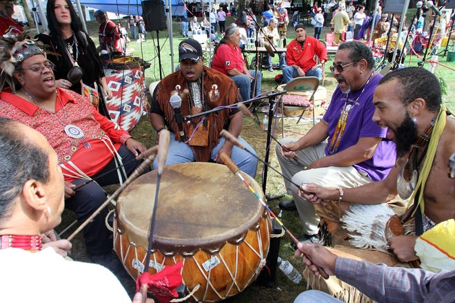 The Eastern Medicine Singers, including from left, Daryl Black Eagle Jamieson, Chief George Spring Buffalo, Darrell Sleeping Wolf and Raymond Two Hawks sing and drum at the Sixth Annual Big Drum Powwow as part of the Sixth Annual New England Native American Culture Week celebration at Roger Williams National Memorial. The Providence Journal/Mary Murphy