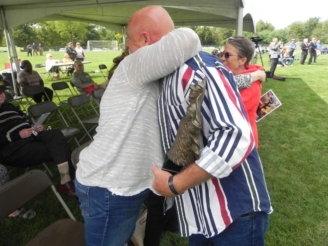 Laurie Truesdell and John Wilding embrace Saturday afternoon during the 11th annual Connecticut Fallen Heroes Foundation tribute. Truesdell's uncle, Army PFC Thomas E. Donovan, was killed in Vietnam in 1968 and Wilding's stepson, Marine Lance Cpl. Tyler O. Griffin, died on April 1, 2010, in Afghanistan.

Adam Benson/NorwichBulletin.com