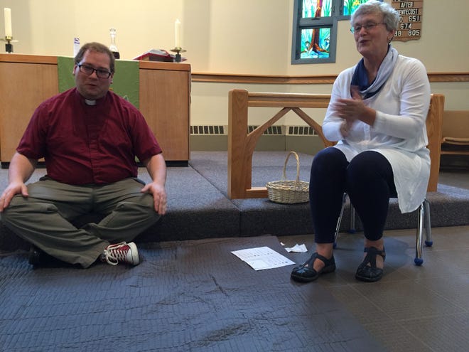 Pastor Aaron Decker (left) and Christ Lutheran Church nursery school Music Teacher Claire Paquette (right) lead a Sing and Play Worship service at the church. BANNER PHOTO/SANDY MEINDERSMA
