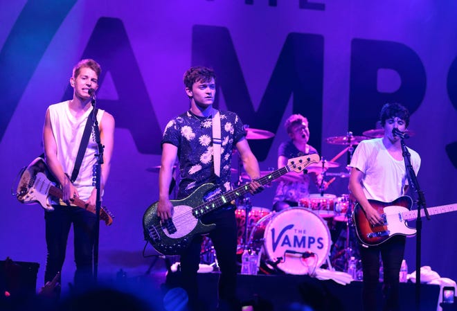 In this July 31 photo, James McVey, from left, Connor Ball, Tristan Evans and Brad Simpson of the band the Vamps perform in concert during their Meet The Vamps Tour 2015 in Philadelphia. The Associated Press