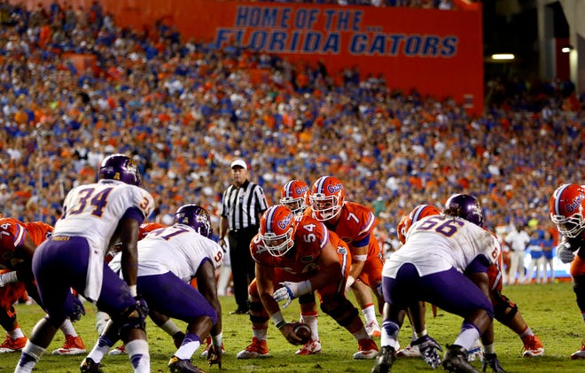 Florida quarterback Will Grier (7) lines up under center Cameron Dillard (54) during the second half at Ben Hill Griffin Stadium on Sept. 12. Florida defeated the East Carolina Pirates 31-24.