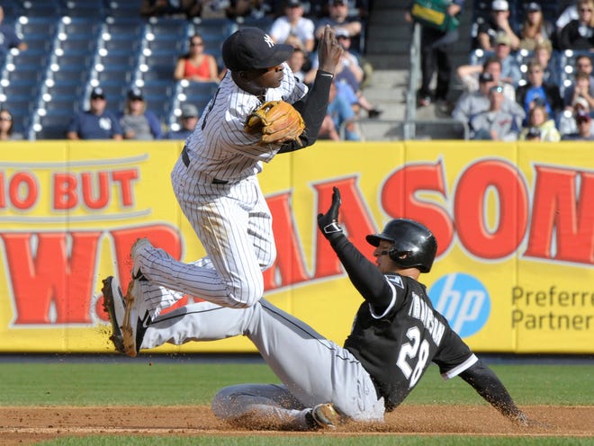 Chicago White Sox player Trayce Thompson, right, is out at second as Yankees shortstop Didi Gregorius relays the ball to first to complete the double play on White Sox's Adam LaRoche on Saturday. Associated Press