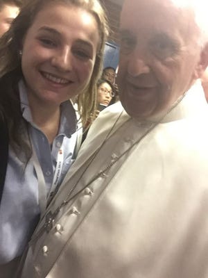 Veronica DiPaul, a senior at John S. Burke Catholic in Goshen, took a selfie with Pope Francis on Friday in New York.