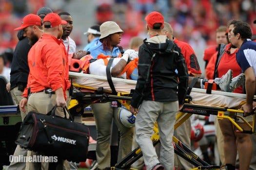 Southern University wide receiver Devon Gales (33) is taken off the field on a stretcher after receiving an injury during an NCAA college football game on Saturday, Sept. 26, 2015, in Athens, Ga.