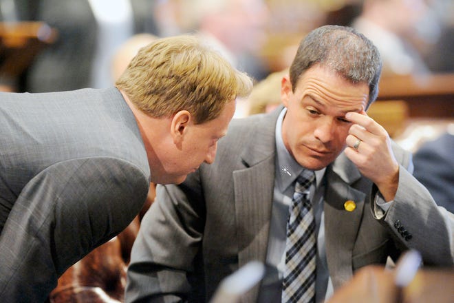 House Democratic Leader Rep. Tim Greimel, left, and House Speaker Rep. Kevin Cotter, right, speak, during a standstill in an all-night session Sept. 10 in Lansing when the Michigan House was deciding whether to expel Rep. Cindy Gamrat and Rep. Todd Courser, two social conservatives who admitted to misconduct in covering up their extramarital affair.