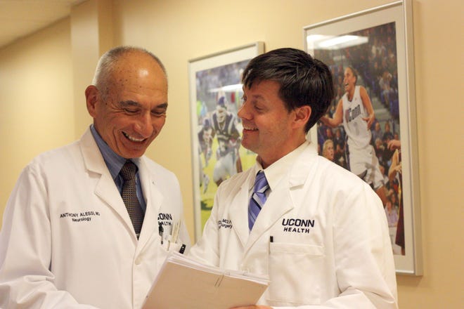 Dr. Anthony Alessi and Dr. Cory Edgar, right, are members of the new NeuroSport program based in Storrs. The program incorporates a variety of doctors to create a valid baseline for testing for concussions in young athletes. Elizabeth Regan/For The Bulletin