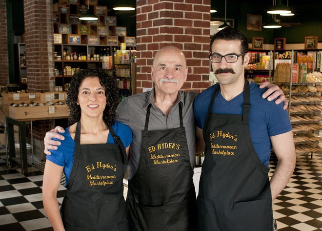 Ed Hyder, center, operates Ed Hyder's Mediterranean Marketplace with his daughter Miriam Hyder and son Greg Hyder. They will mark the 40th anniversary of the store in December. Ed grew up working for his father and uncles in the Grafton Hill triple-decker where his Lebanese grandfather had started a grocery store in the 1930s. Photography by Rick Cinclair