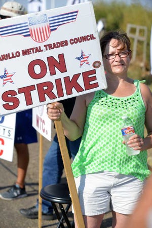 Betty Watson works the picket line Monday at the Pantex Plant. The strike is entering its 33rd day today.