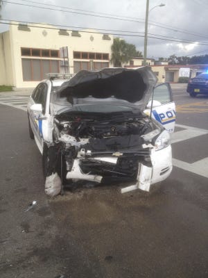 The damaged patrol car of South Daytona police officer Sarah Jackson is shown after she crashed in Edgewater into a car driven by Joseph Guinn, of New Smyrna Beach, after it cut into her path Friday as she drove to work. She was not seriously injured. Provided photo
