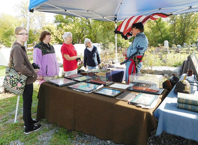 Stuart Lehman, of the Northern Frontier Project, talks with visitors about the Civil War items he has on display during Living History Weekend at the German Flatts Town Park. TIMES TELEGRAM PHOTO/DONNA THOMPSON