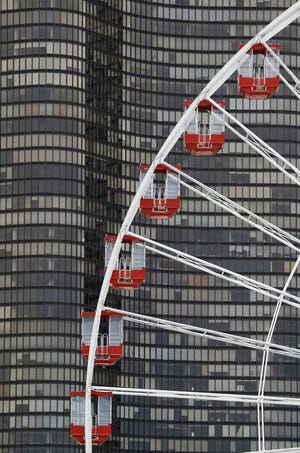 In this Wednesday, June 13, 2012, photo, the cars of the Ferris Wheel are seen at Chicago's nearly century-old Navy Pier. (AP Photo/Charles Rex Arbogast)