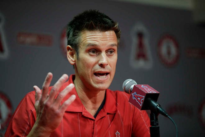 FILE - In this April 3, 2015 file photo, Los Angeles Angels General Manager Jerry Dipoto speaks to reporters during a news conference in Anaheim, Calif. The Seattle Mariners have found their new general manager, hiring former Angels GM Jerry Dipoto. Seattle announced Dipoto's hiring Monday, Sept. 28, 2015. He replaces Jack Zduriencik, who was fired in late August after seven disappointing seasons during which the club failed to end its playoff drought. (AP Photo/Jae C. Hong)