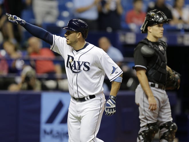 Tampa Bay Rays' Asdrubal Cabrera celebrates in front of Miami Marlins catcher J.T. Realmuto after his two-run home run during the eighth inning of an interleague baseball game Tuesday, Sept. 29, 2015, in St. Petersburg.
