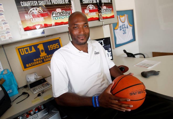 In this Sept. 18, 2010, file photo, former UCLA basketball player Ed O'Bannon Jr. sits in his office in Henderson, Nev. A federal appeals court agreed Wednesday, Sept. 30, 2015, that the NCAA's use of college athletes' names, images and likenesses in video games and TV broadcasts violated antitrust laws but struck down a plan to allow schools to pay players up to $5,000. The decision came in a lawsuit filed by O'Bannon and 19 others.