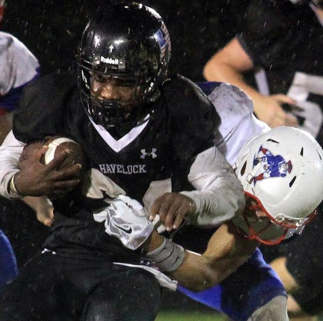 Havelock running back Tony Sharpe fights to break free from a tackle in last week's game versus West Carteret.