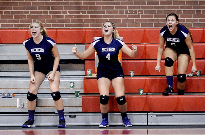 Bartlett Yancey's Abigail Goots, Katie Duckett and Julia McGregor cheer their teammates from the bench during Tuesday night's victory at Graham.