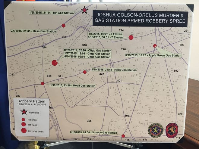 A map is displayed at a news conference at the Nassau County District Attorney's Office in Mineola, N.Y., that shows the gas stations that Jason Golson-Orelus is accused of robbing. Police across the country are increasingly using GPS tracking devices hidden in stacks of cash, pill bottles and other objects to catch thieves. Investigators had secretly embedded a GPS tracking device in a stack of bills that led to the arrest of Golson-Orelus.