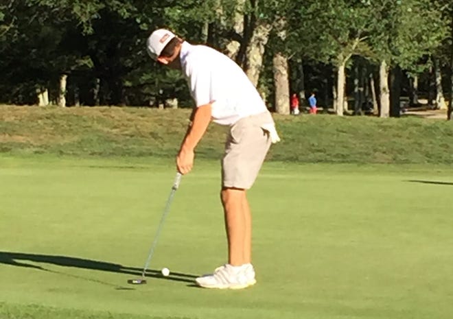 Oliver Ames senior golfer Jack Green sinks a putt. The Tigers are 9-0 this season and have clinched a tournament berth. 

Courtesy photo
